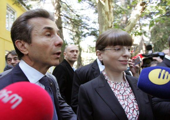 Ivanshvili and his wife outside a Georgian polling station in 2012