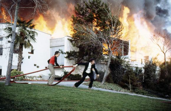«Funky Claude» Nobs and Jean-Paul Marquis with a fire hose, Montreux 1971.