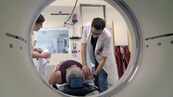 Doctor preparing patient for a scan