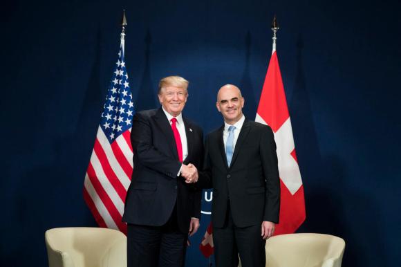 Swiss Federal President Alain Berset, right, and US President Donald J. Trump, left, shake hands during a bilateral meeting