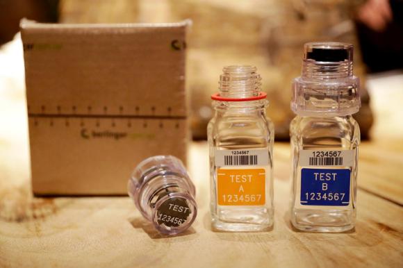 Three doping test bottles