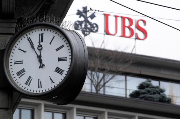 UBS bank logo with a clock in the foreground