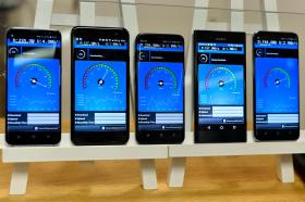 Mobile phones display download rates at a Swisscom media conference on the 5G network in Zurich on Wednesday, June 28, 2017
