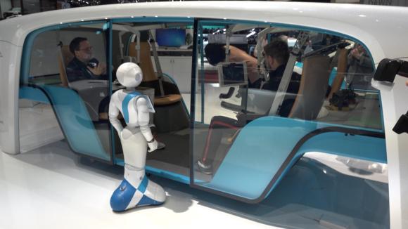 Rinspeed s snap concept vehicle with a robot outside the pod