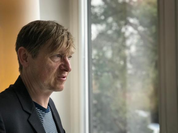man at window