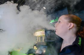 woman smoking e-cigarette