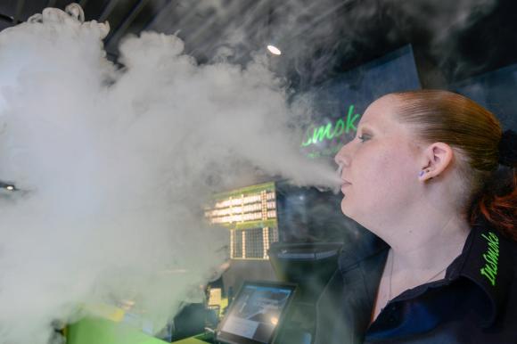 woman smoking e-cigarette