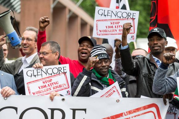 Demonstrators protest outside Glencore s annual meeting in Zug
