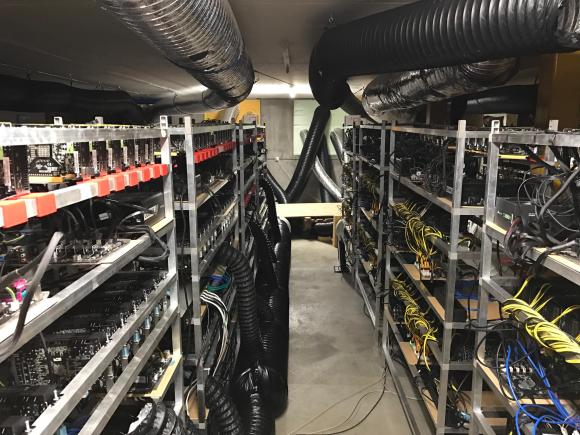 A crypto mining farm full of pipes and cables