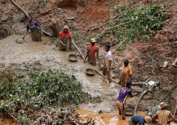 Men work at Makala gold mine camp near the town of Mongbwalu in Ituri province, eastern Democratic Republic of Congo.