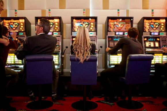 People playing at slot machines