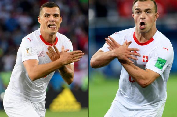 A picture of two Swiss footballers making the double-eagle gesture