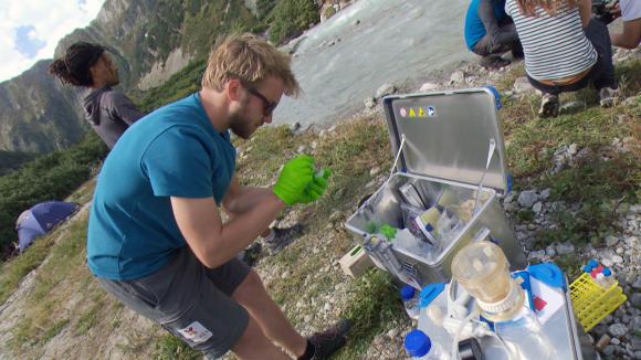 Scientist analyses water sample