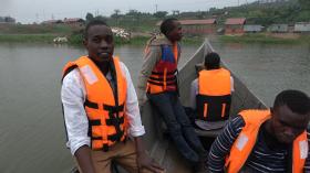 David and crew return from inspecting fish cages on Lake Victoria
