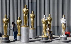 Oscar prop statues being painted in a California warehouse