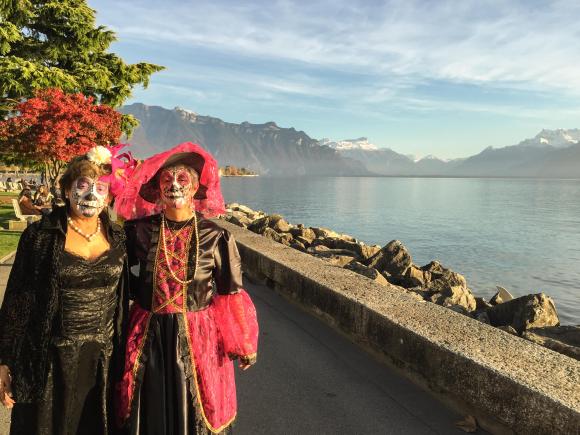 Two women in costume on the lake