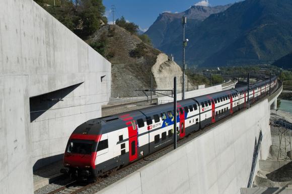 A passenger train heads for Loetschberg Base Tunnel near Visp in the canton of Valais, Switzerland
