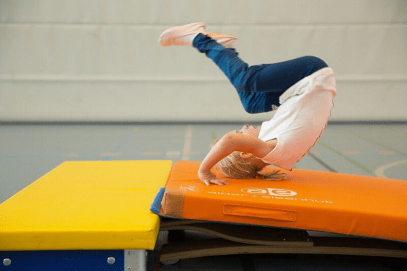 A girl doing a somersault