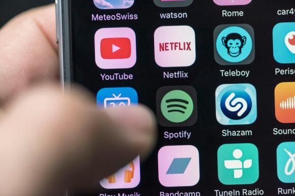 Apps including Netflix, Spotify, YouTube on a mobile phone
