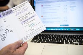 Vote form next to a computer