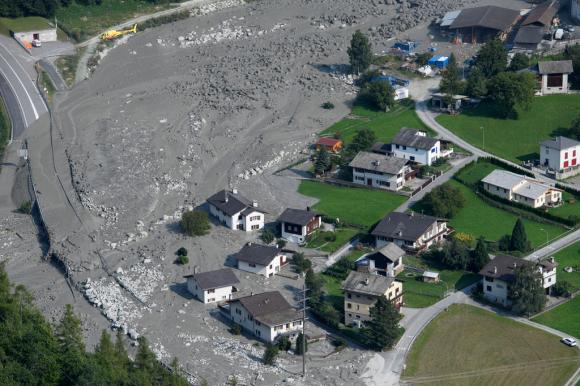 houses surrounded by mudslide