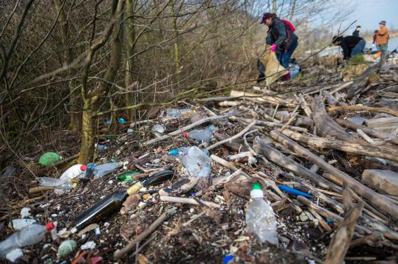 Volunteers collect plastic and other trash from the Reserve du Fort at Noville on the shores of Lake Geneva on April 7, 2018