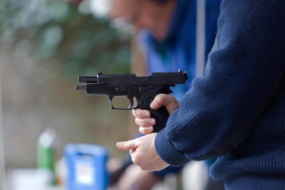 A man loads a pistol
