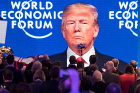 US President Donald Trump on a big screen at WEF