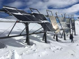Solar panels on snowy mountain top
