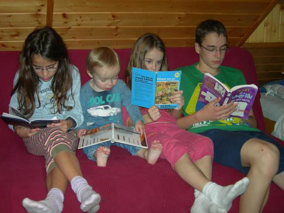 Kids studying on settee
