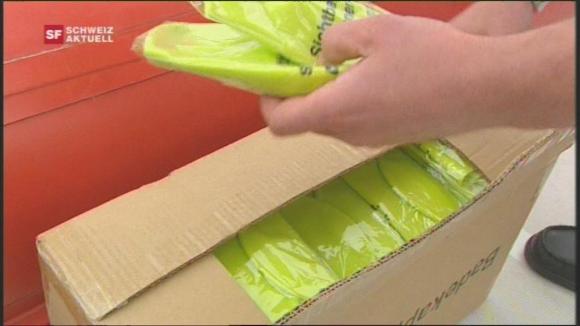 Yellow swim caps in a box