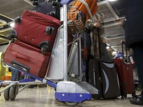 Suitcases on an airport trolley