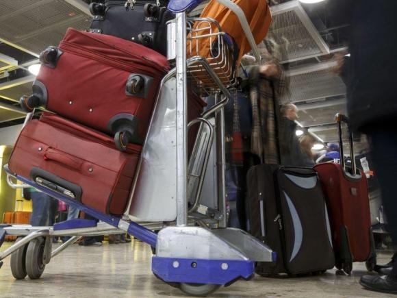 Suitcases on an airport trolley
