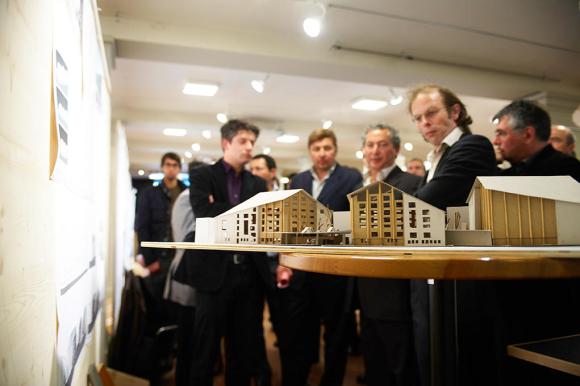 Architects and Samih Sawaris inspect the model of the luxury resort.