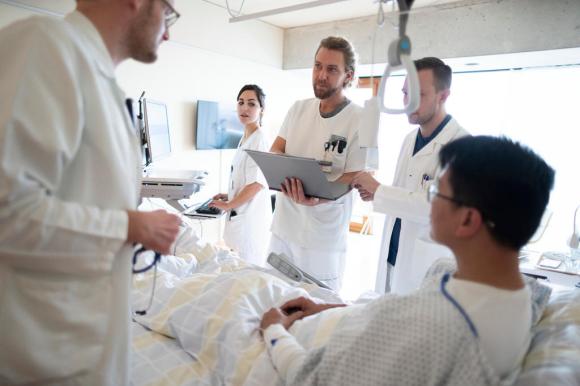 Medical staff during a ward round in a hospital