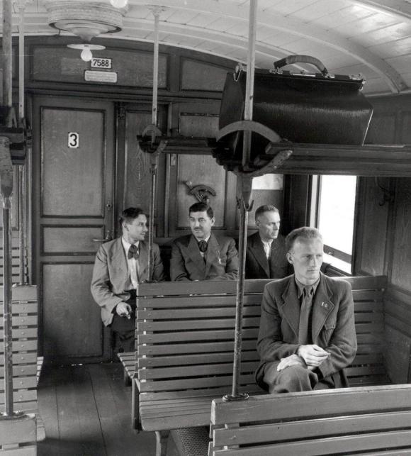 A picture of 3rd-class rail travel in wooden class in Switzerland