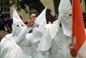 Swiss police investigate KKK carnival costumes - SWI