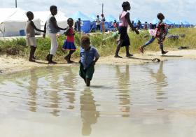 Children playing near water in Mozambique