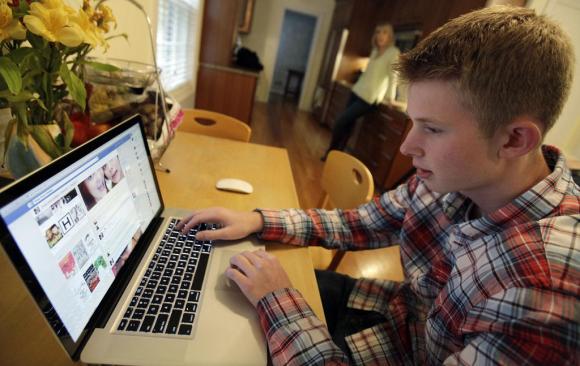 Teen in front of his computer