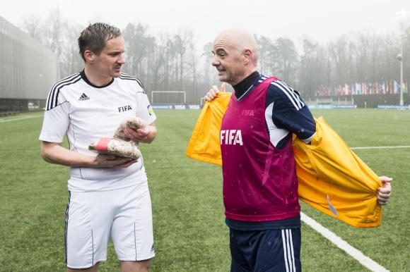 FIFA President Gianni Infantino (right) and Valais prosecutor Rinaldo Arnold