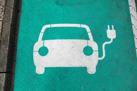 logo of electric car on green battery
