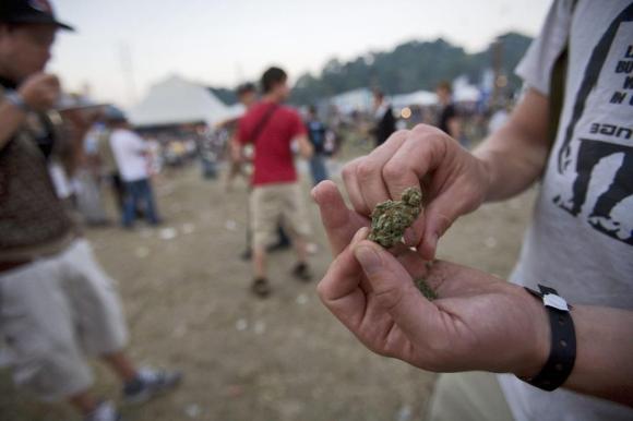 Young people smoke cannabis at the St Gallen Openair music festival in 2008