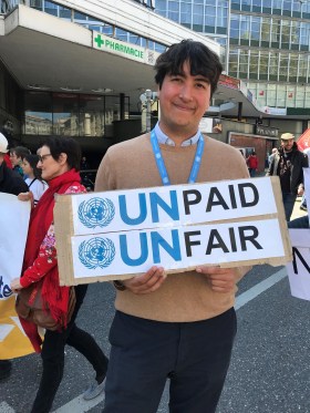 Tom, an OCHA intern from Australia, at the Geneva May 1 demo