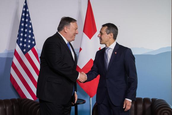 Pompeo and Cassis shaking hands