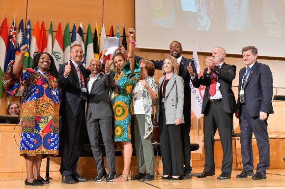 ILO delegates celebrate at the UN in Geneva