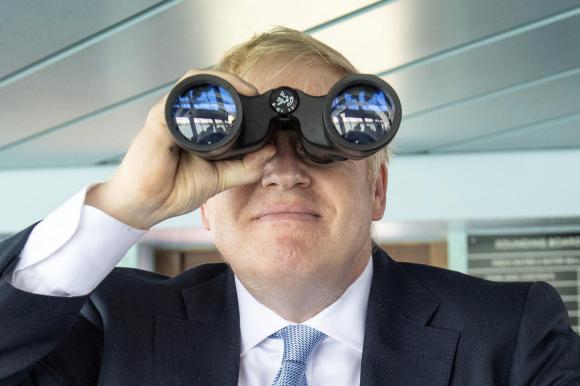Boris Johnson looking rthroujgh binoculars