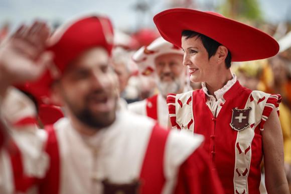 Actors in the Fête des Vignerons show in red and white costumes
