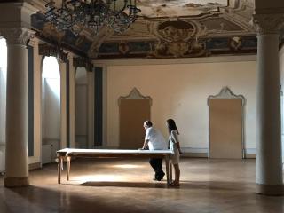 Two people in the abandones grand salon now