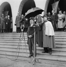 Interor Minister Etter delivering a speech outside a building