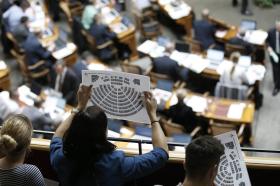 Woman checking seating plan in the Swiss parliament